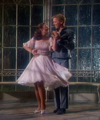 Liesl (Charmian Carr) and Rolfe (Daniel Truhitte) dancing in the gazebo in The Sound of Music.